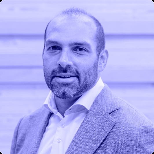 Official blue-toned portrait of GBG chief executive Dev Dhiman