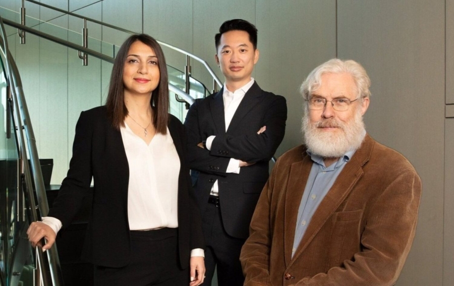 GC Therapeutics co-founders Parastoo Khoshakhlagh, Alex Ng and George Church standing beside a spiral staircase