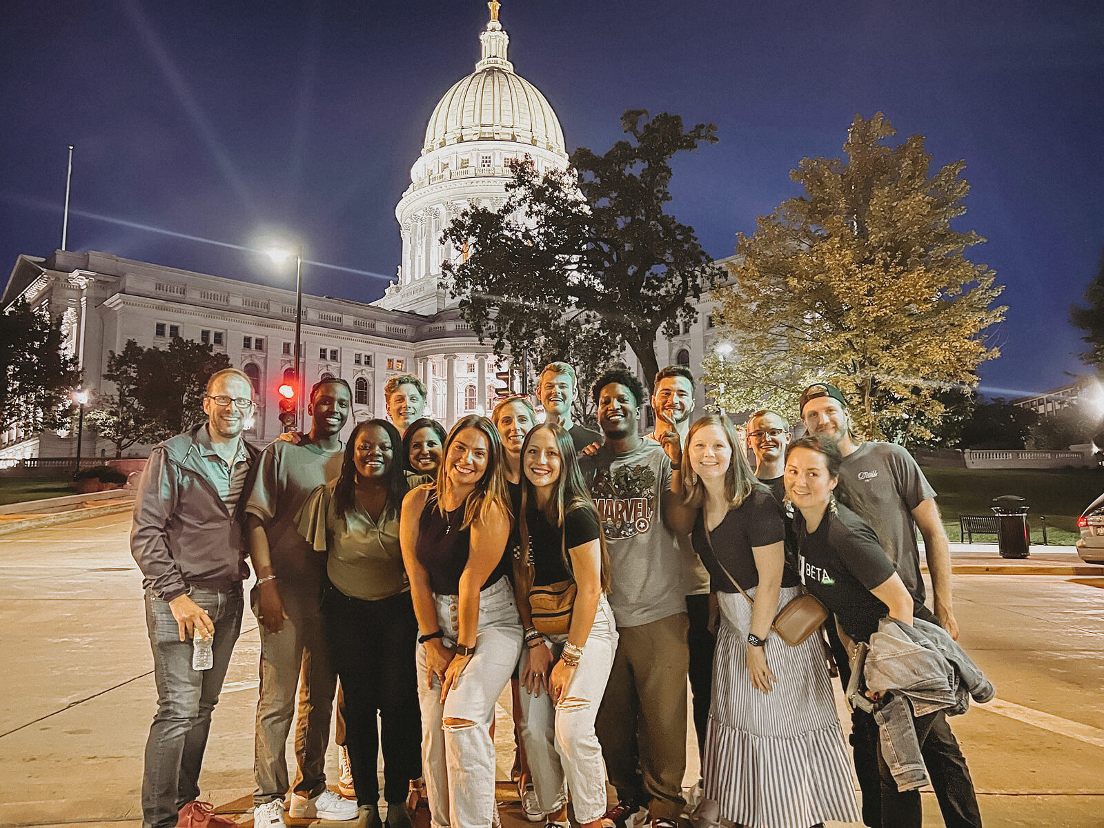 gener8tor staff gathered outside the illuminated Wisconsin State Capitol in Madison