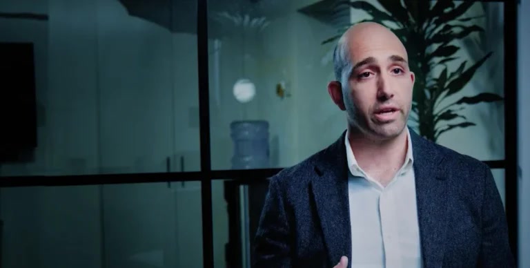 Ben Cohen of Neptune Networks speaking in an office
