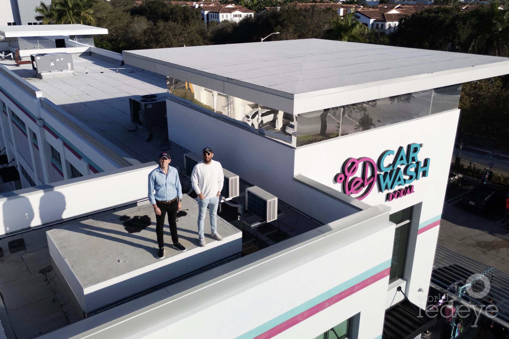 Geoff Karas and Justin Landau standing on the roof of the El Car Wash facility in Doral