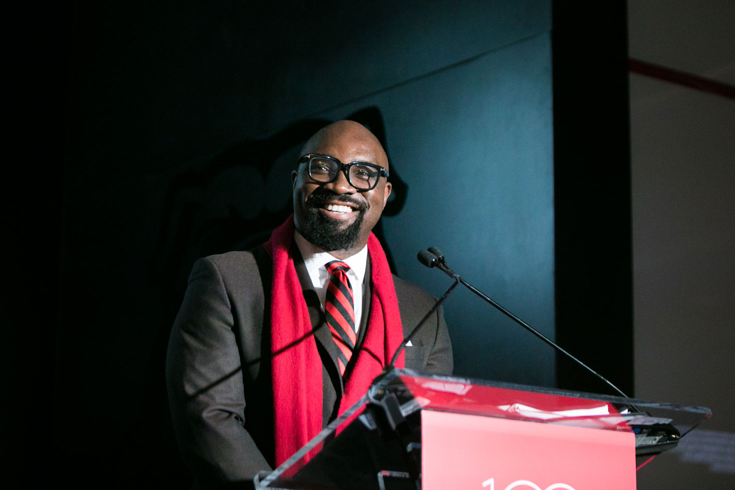 George Azih smiling at the lectern during the 2020 Bulldog 100 celebration