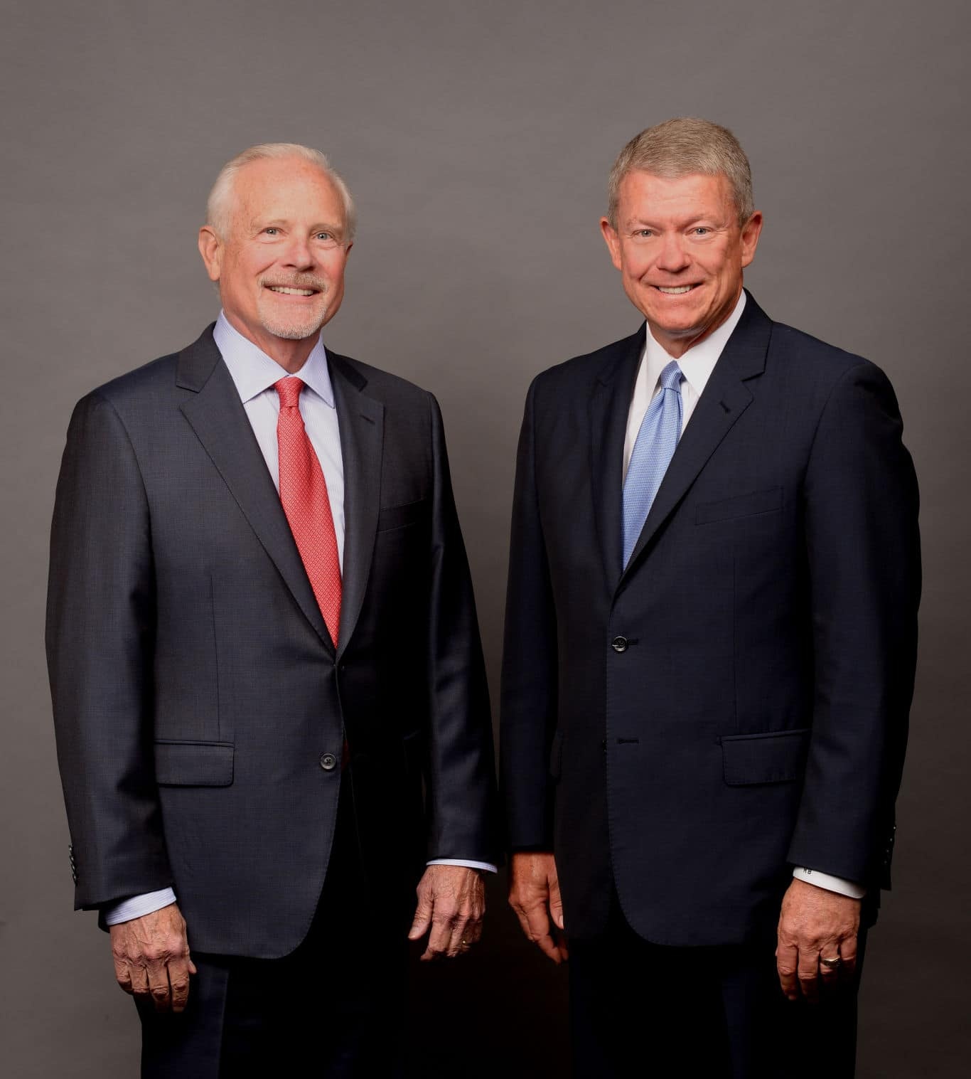 George Jones, left, standing beside CrossFirst’s Ron Baldwin in a publicity photograph