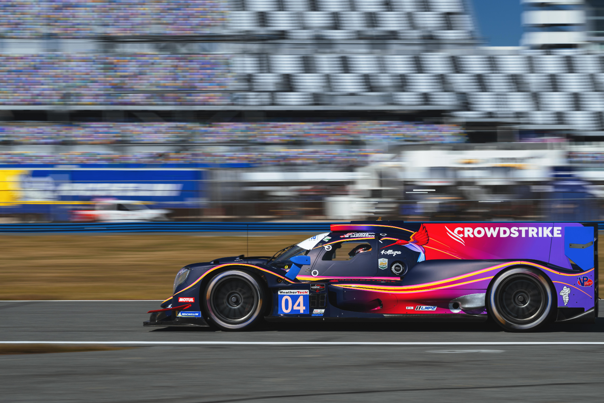 The number 04 CrowdStrike Racing prototype on track