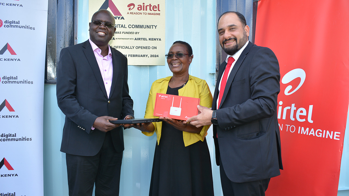 George Odenyo, left, with headteacher Mary Ondieki and Airtel Kenya managing director Ashish Malhotra at a school connectivity event.