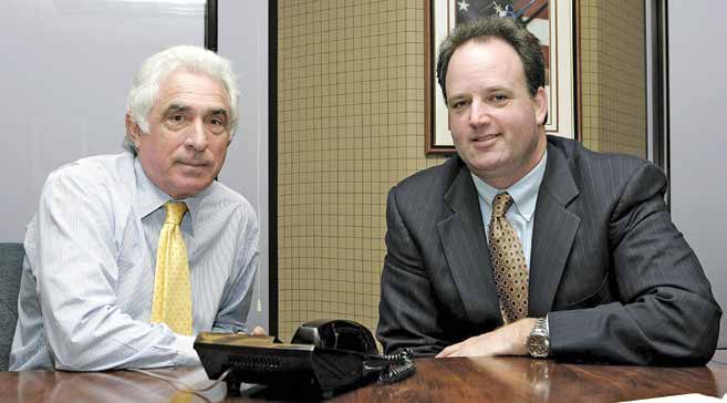 Ted Forstmann and George Pyne seated together in an office