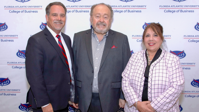 George Schaeffer, center, at Florida Atlantic University’s Business Leader of the Year ceremony