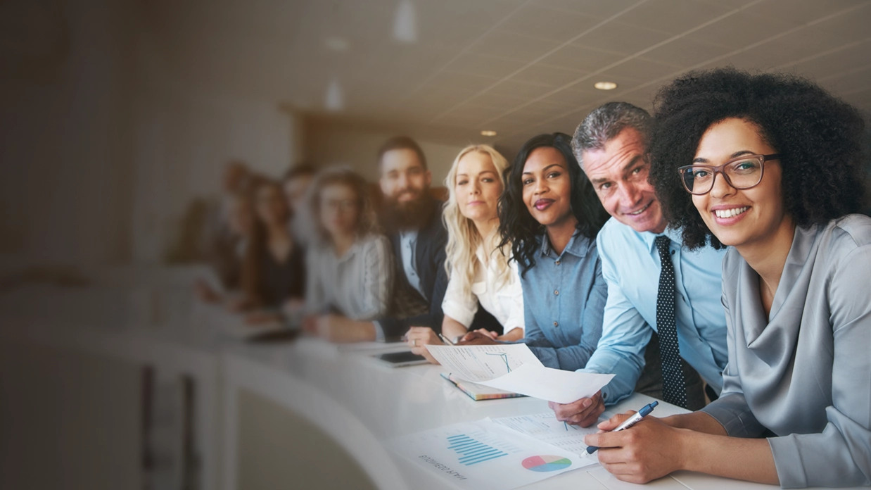 A business team seated together at a conference table