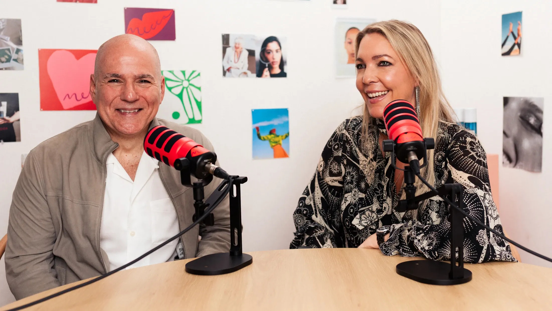 Gerard Camme seated at a podcast table in conversation with a host