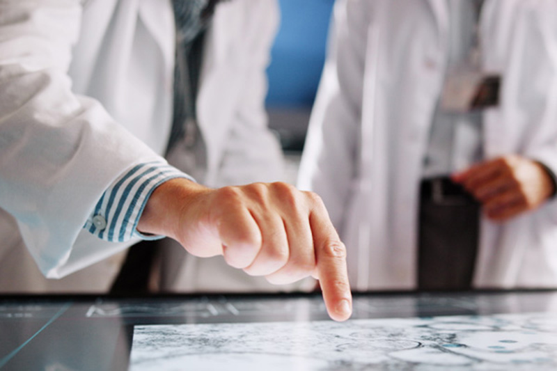 Pathologist using the PathFlow digital pathology workspace