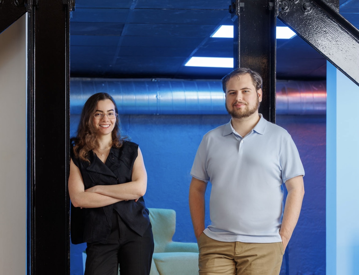 ZeroEntropy cofounders Ghita Houir Alami and Nicholas Pipitone standing together in an office