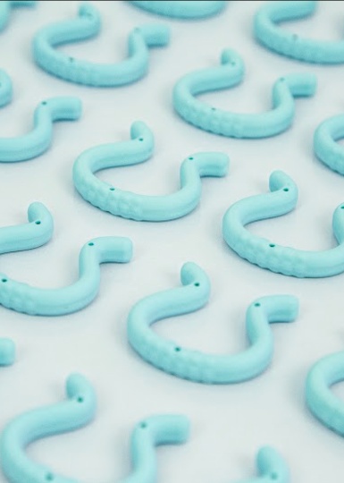 Rows of pale blue horseshoe-shaped Giddy devices