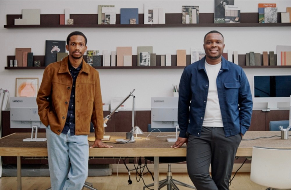 Chidi Williams and Gideon Ebose standing in a workspace