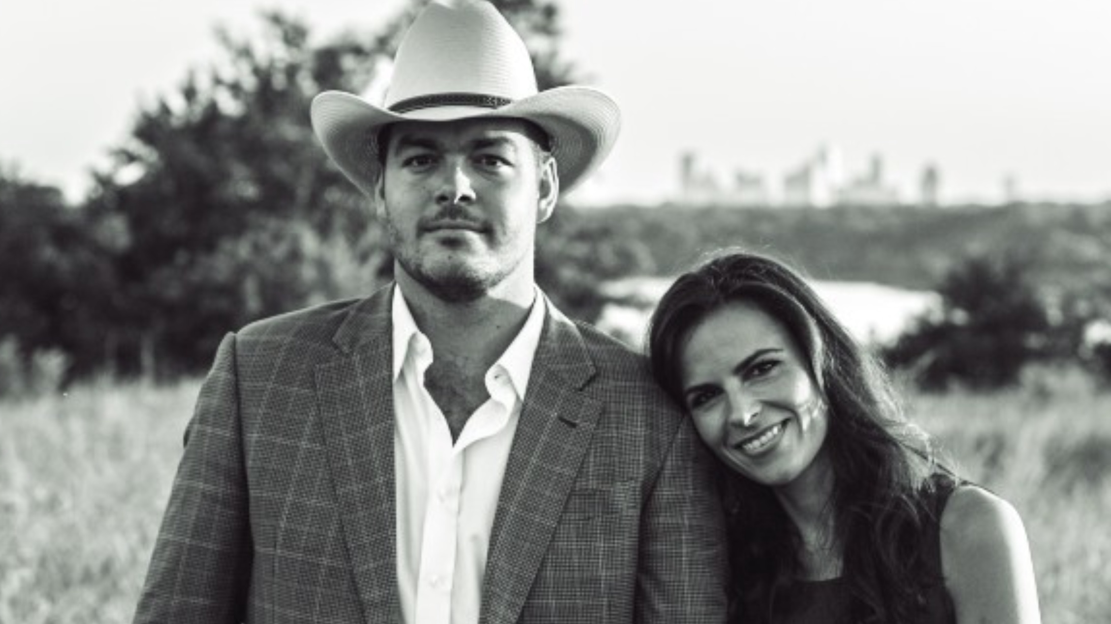 Black-and-white photograph of Gideon Powell and a woman outdoors, published with his CoinDesk interview
