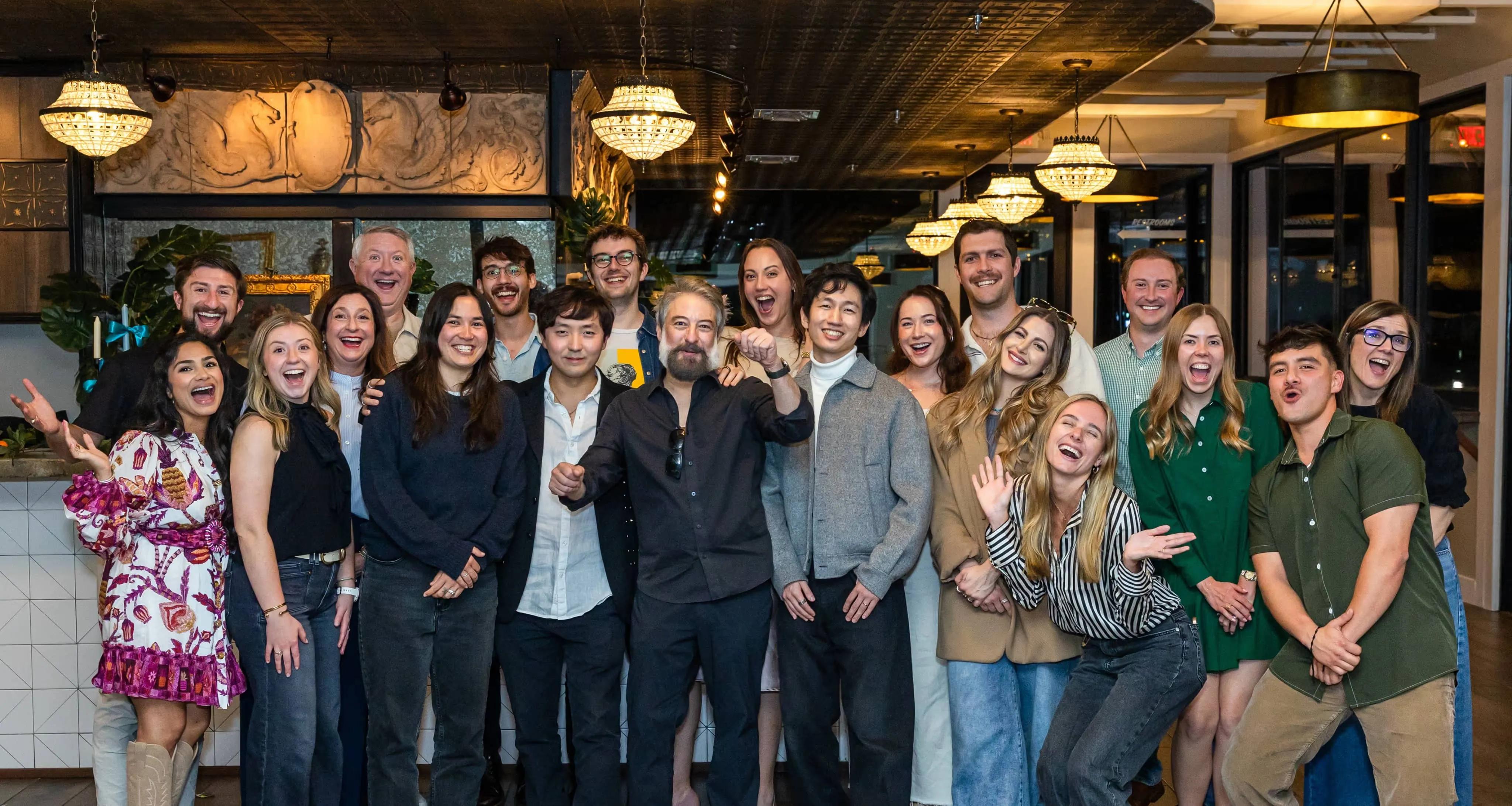 GigFinesse team gathered together in a warmly lit venue