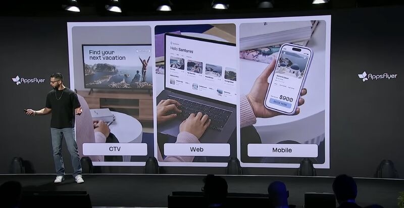 Gil Bouhnick presenting an AppsFlyer slide connecting CTV, web and mobile