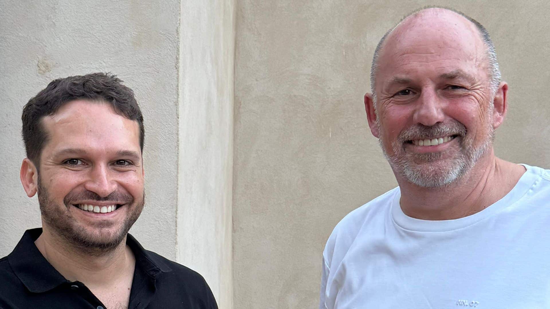 Gil Perry and simpleshow CEO Karsten Böhrs stand together at the announcement of D-ID's acquisition of simpleshow