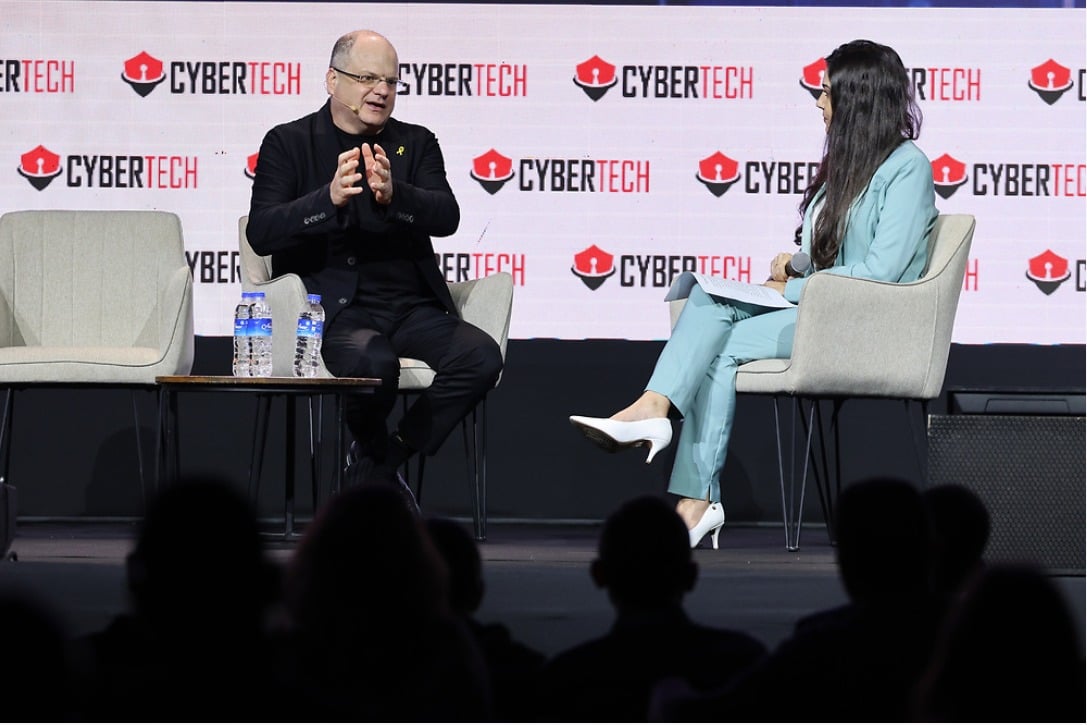 Gil Shwed speaking with an interviewer on stage at Cybertech in Tel Aviv