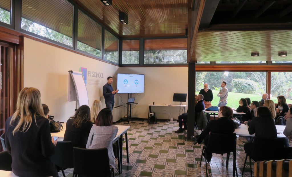 Giordano Bottà presenting Allelica at Pi School in Rome to a seated audience