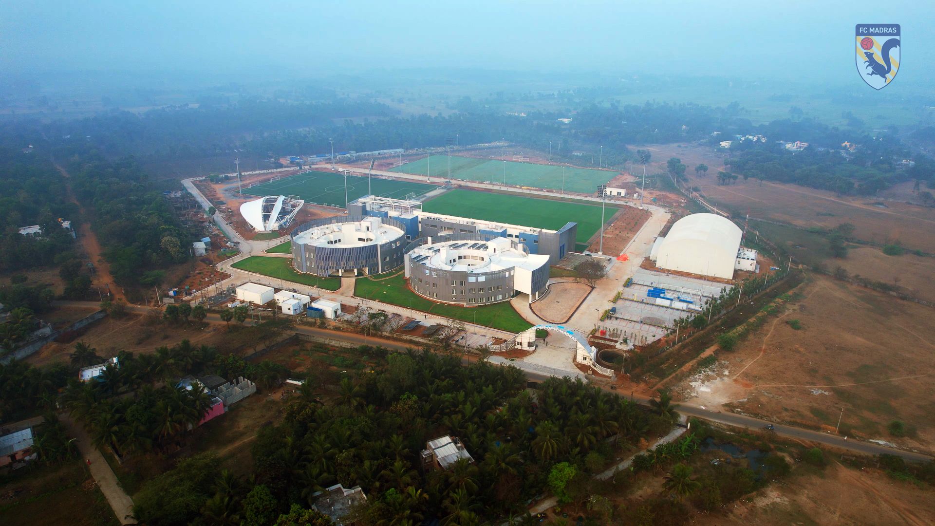 Aerial view of the FC Madras academy, with football pitches and residential buildings