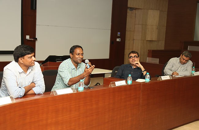 Girish Ramachandra, at far left, seated with fellow panellists at IIM Bangalore in 2016