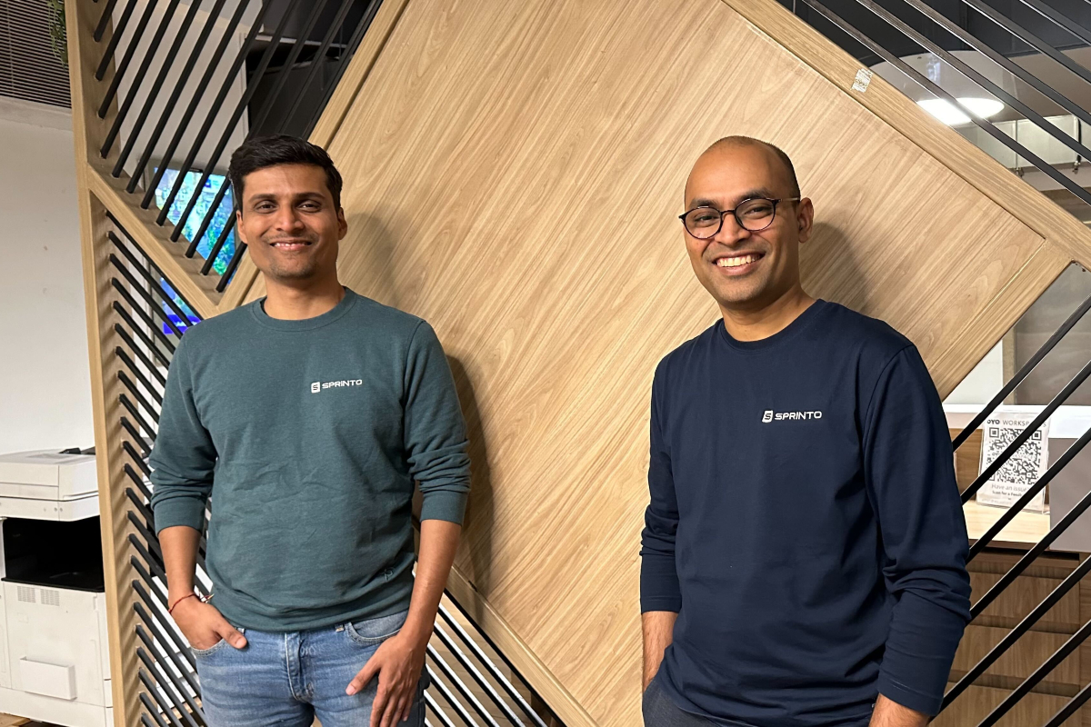 Girish Redekar, left, and Sprinto co-founder Raghuveer Kancherla standing together in an office