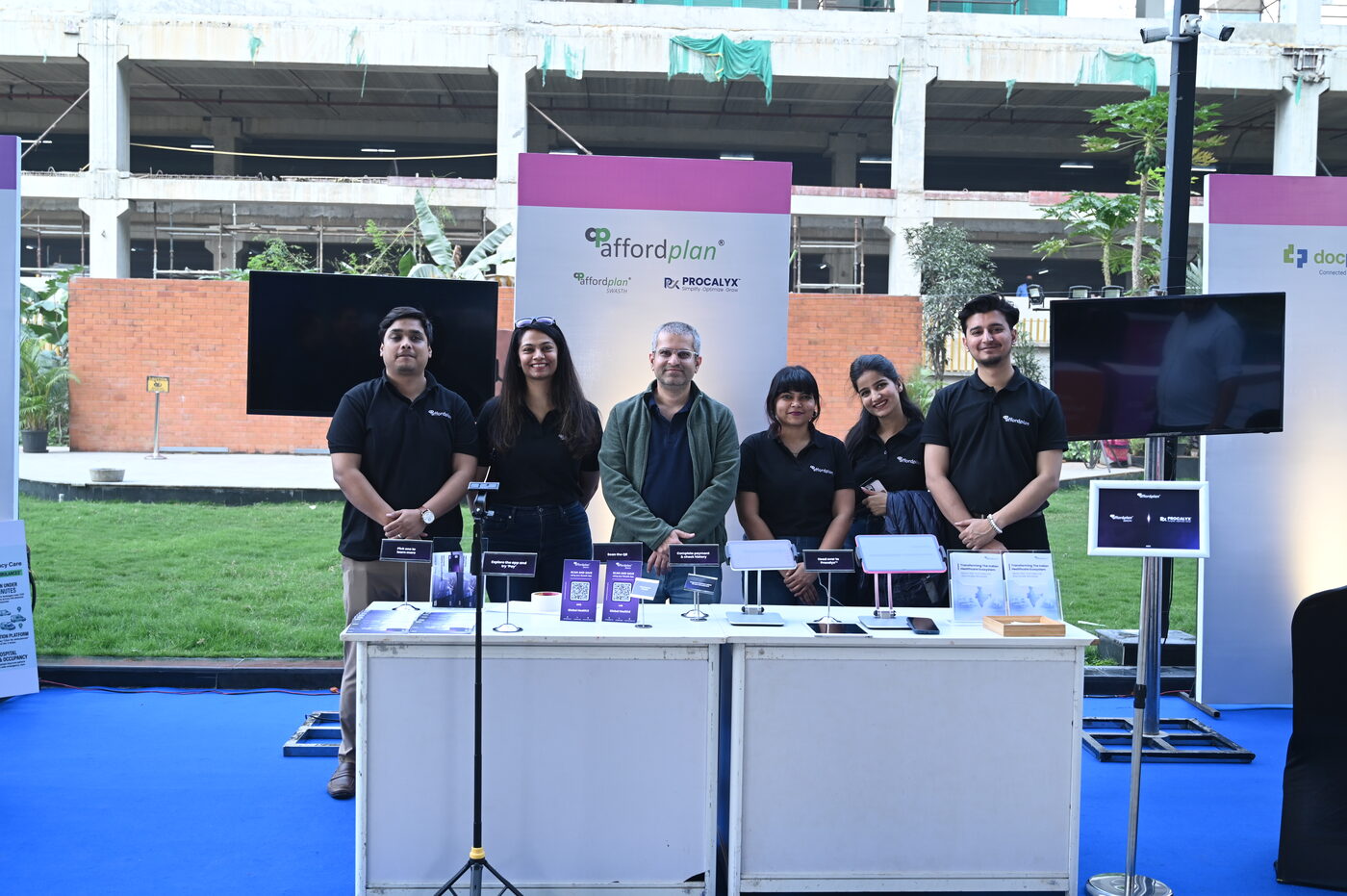 Affordplan team standing behind product displays and tablets at Pulse 2026