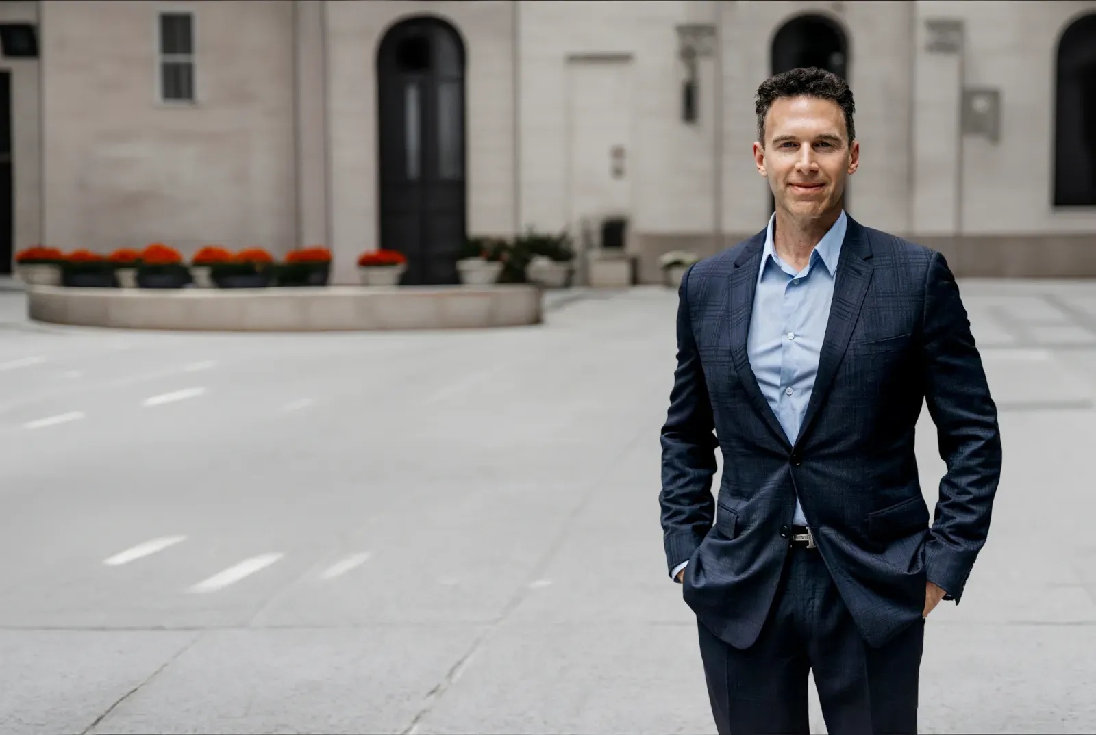 Globalive founder Anthony Lacavera standing outdoors in a suit