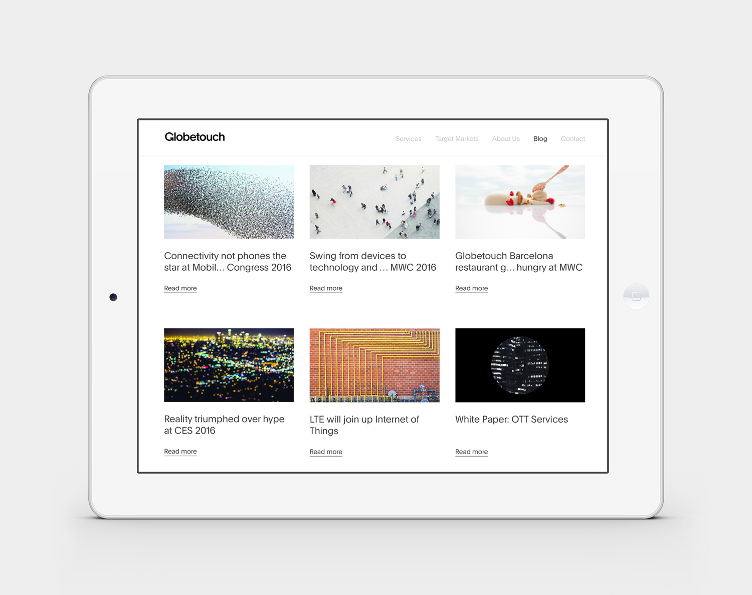Globetouch's 2016 website displayed in a tablet mockup, with a grid of mobility and technology stories