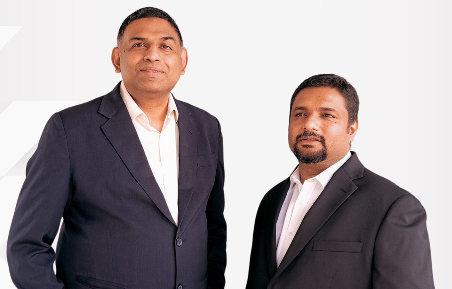 Gnani.ai founders Ganesh Gopalan and Ananth Nagaraj standing together