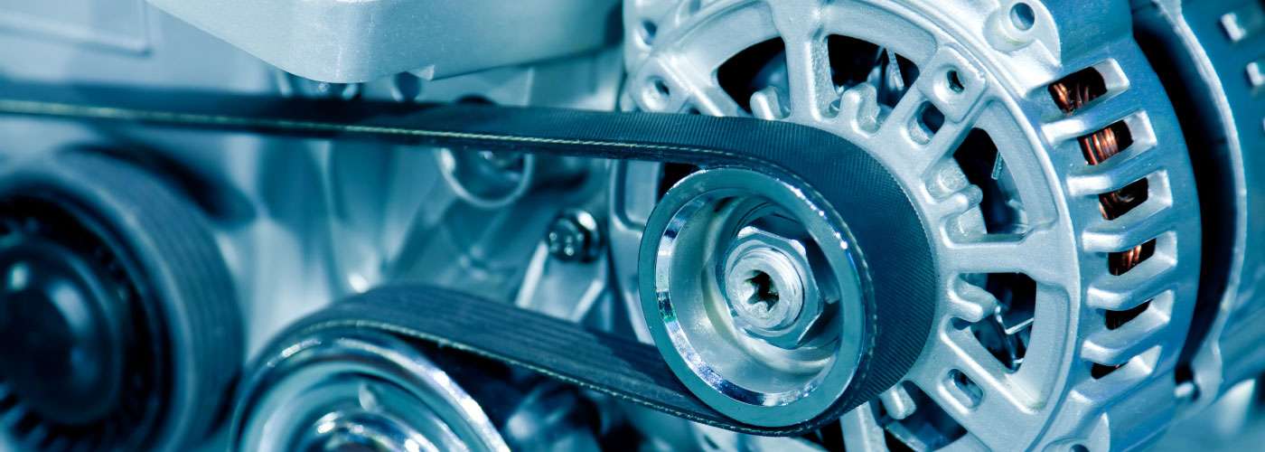 Close view of an automotive belt drive and alternator
