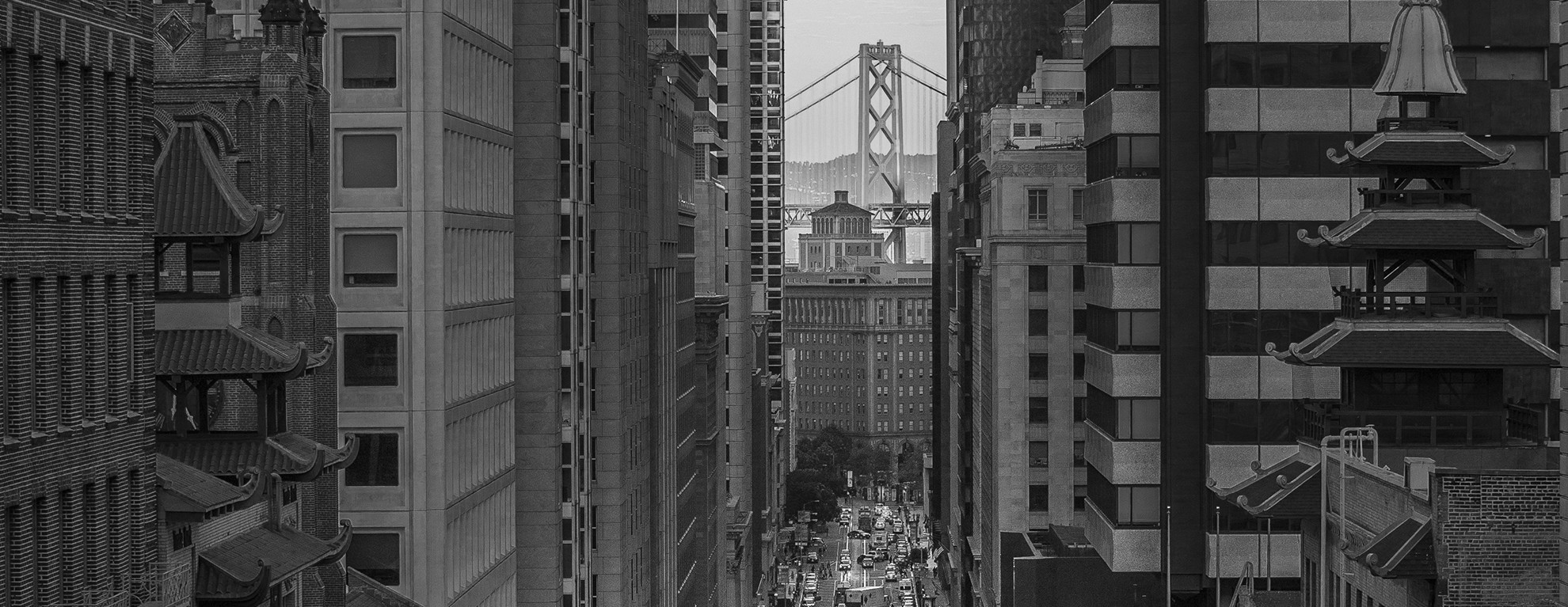 Black and white view across downtown San Francisco toward the Bay Bridge