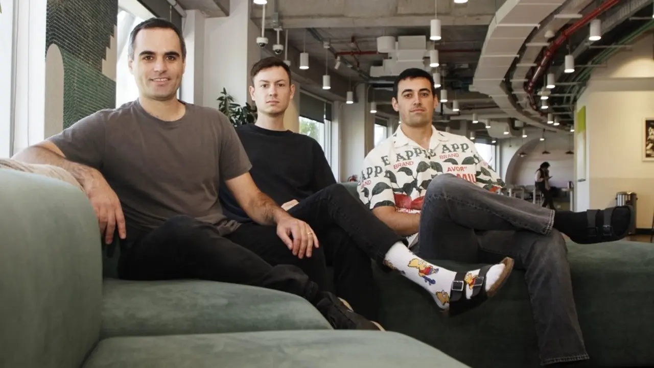 Gonzalo Enei and his two Perhaps co-founders seated together in an office