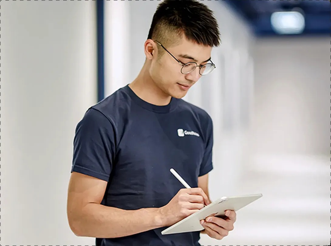 Steven Chan writing on a tablet with a stylus