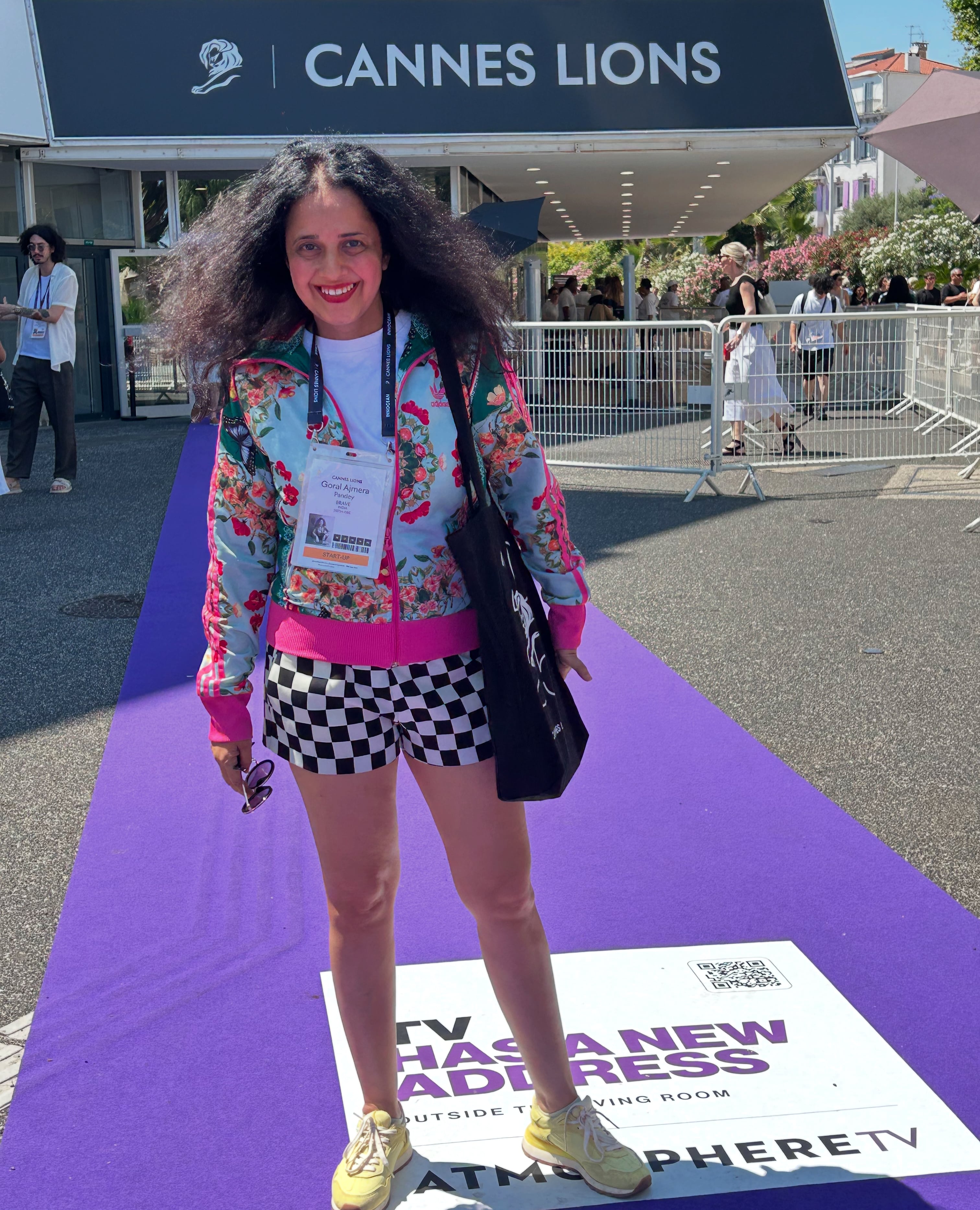 Goral Ajmera outside the Cannes Lions venue, wearing a floral jacket and checked shorts