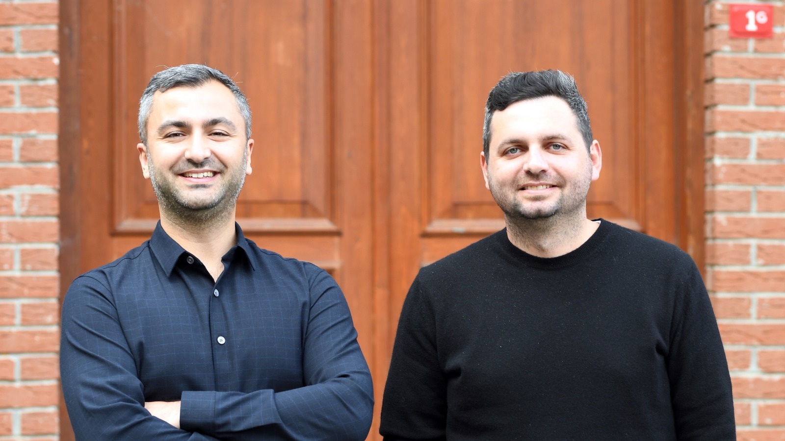 fal co-founders Burkay Gur and Gorkem Yurtseven standing together