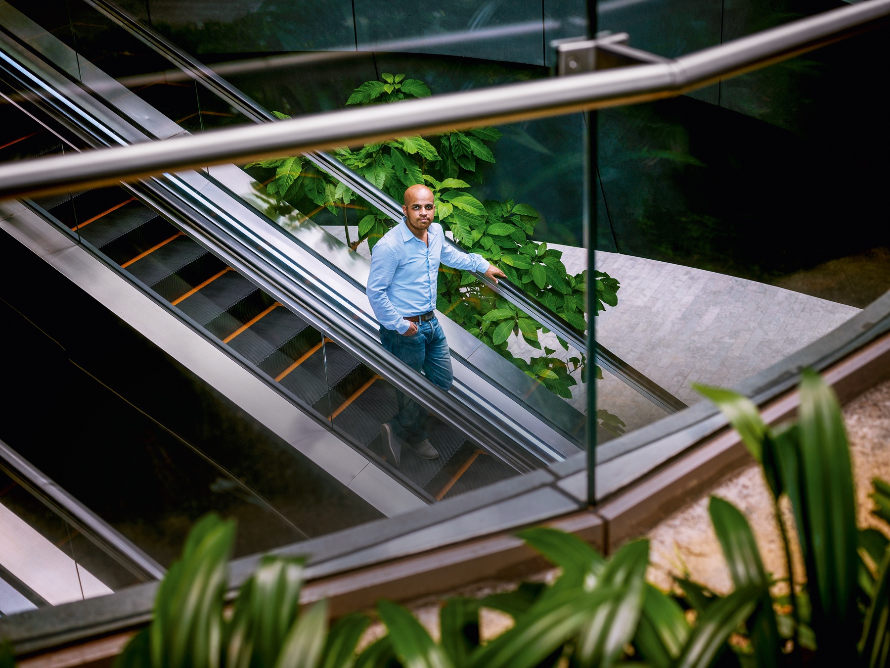 Gourab Mukherjee on an escalator in Singapore