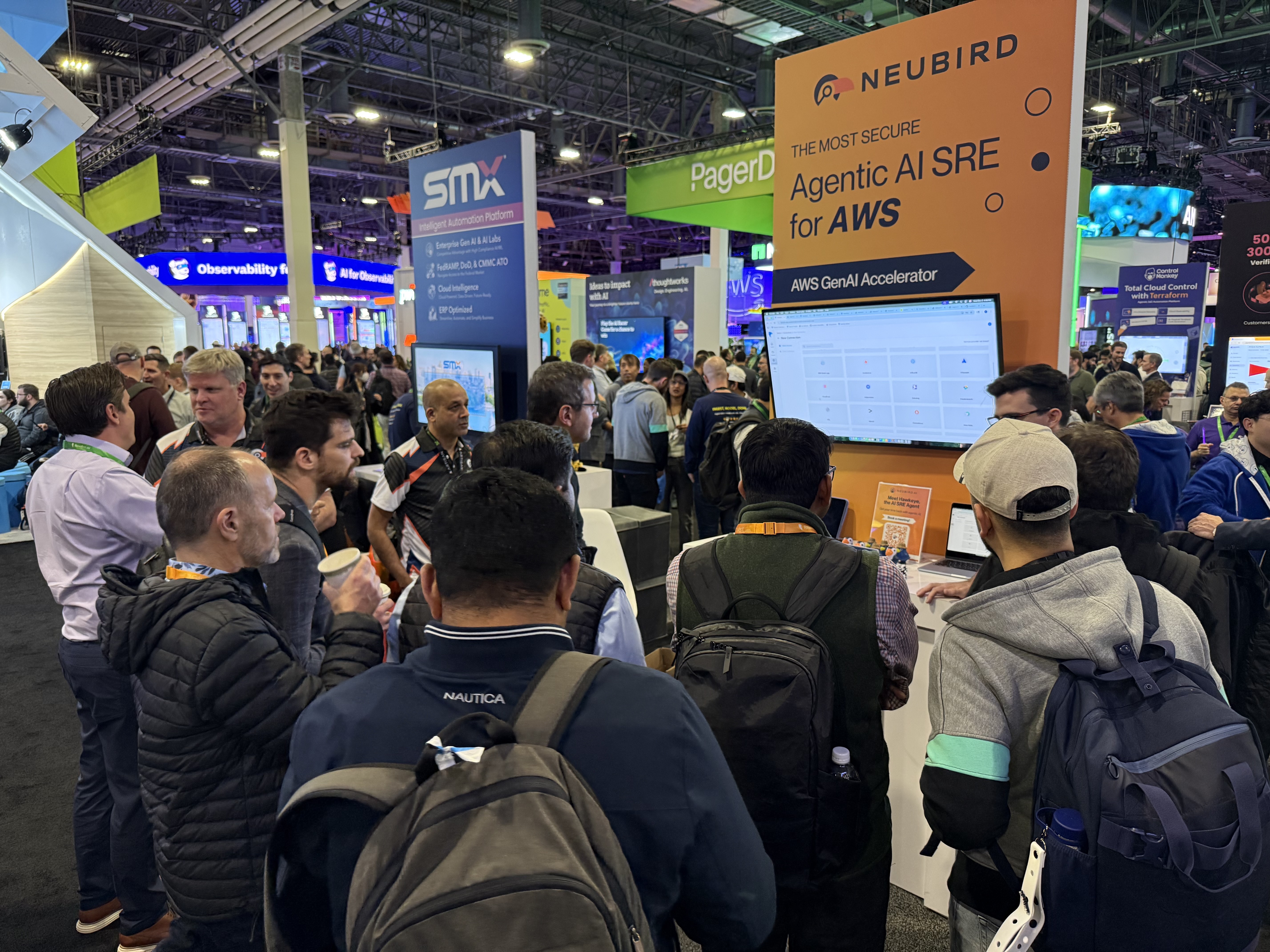 Visitors gathered for a demonstration at the NeuBird booth at AWS re:Invent 2025