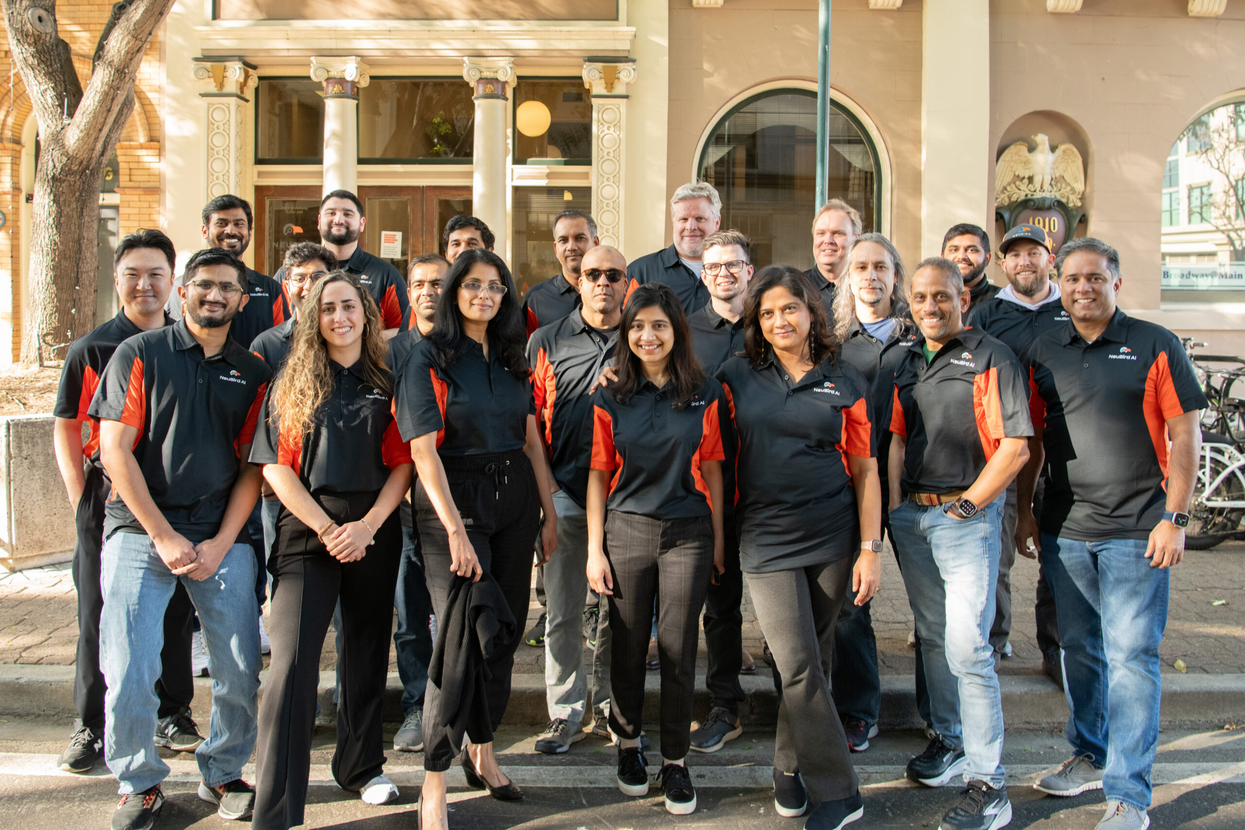 The NeuBird team standing together outdoors, with Goutham Rao near the right of the front row