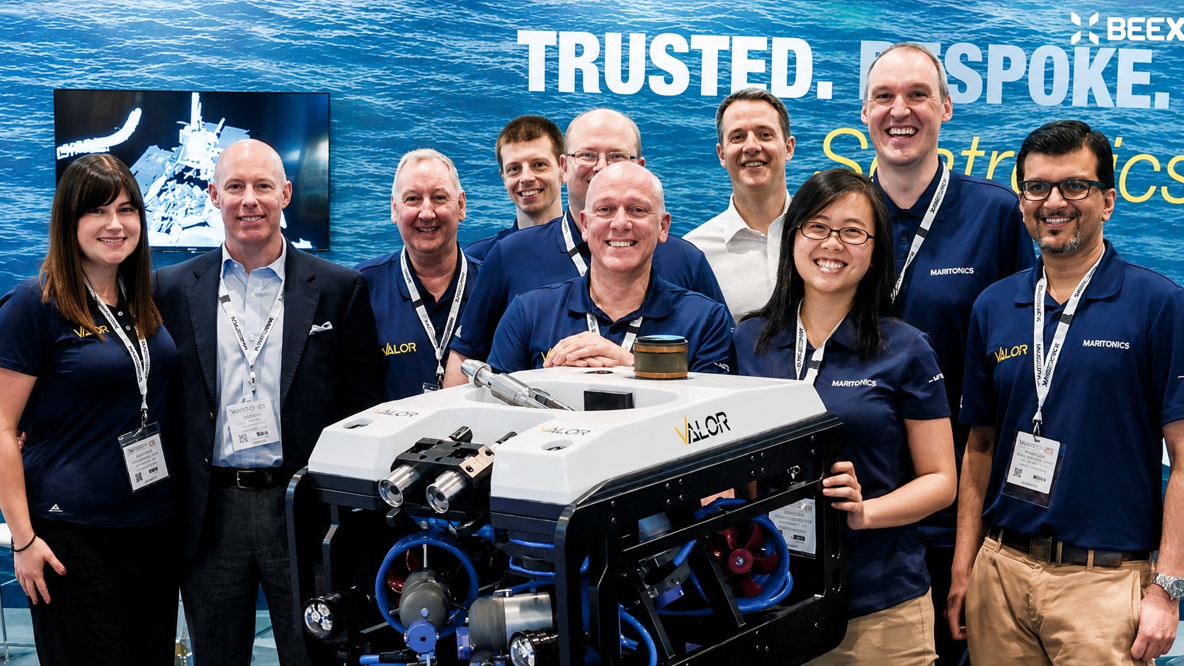 Grace Chia with subsea industry colleagues and a remotely operated underwater vehicle
