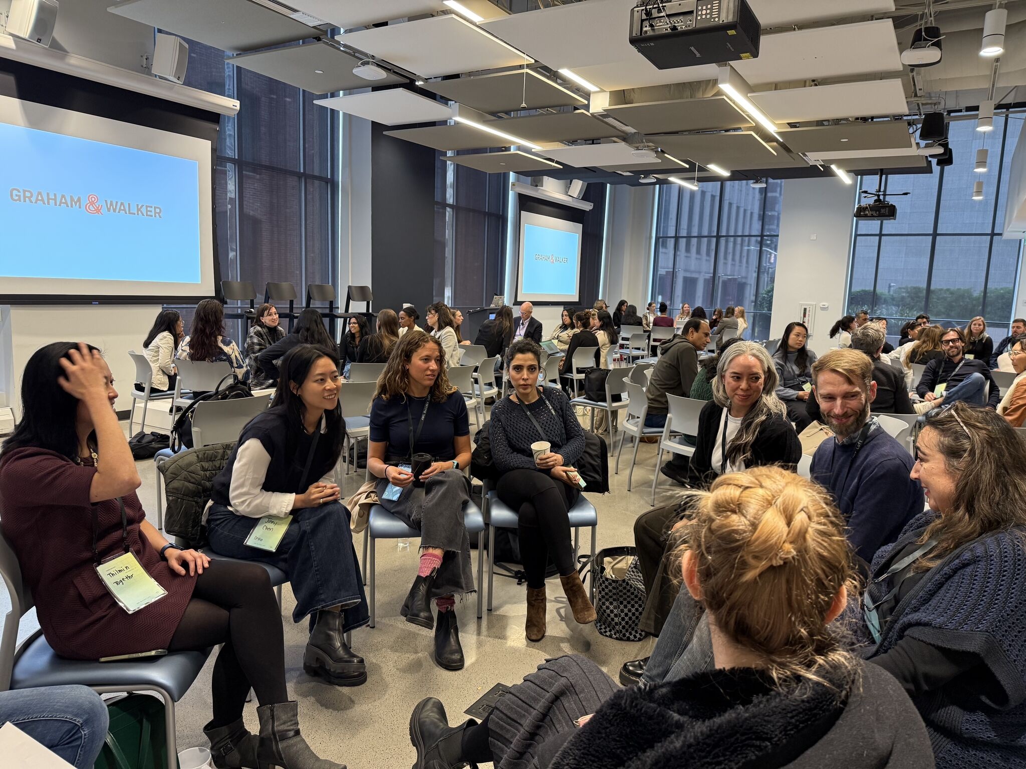 Founder Day attendees sit in small discussion circles