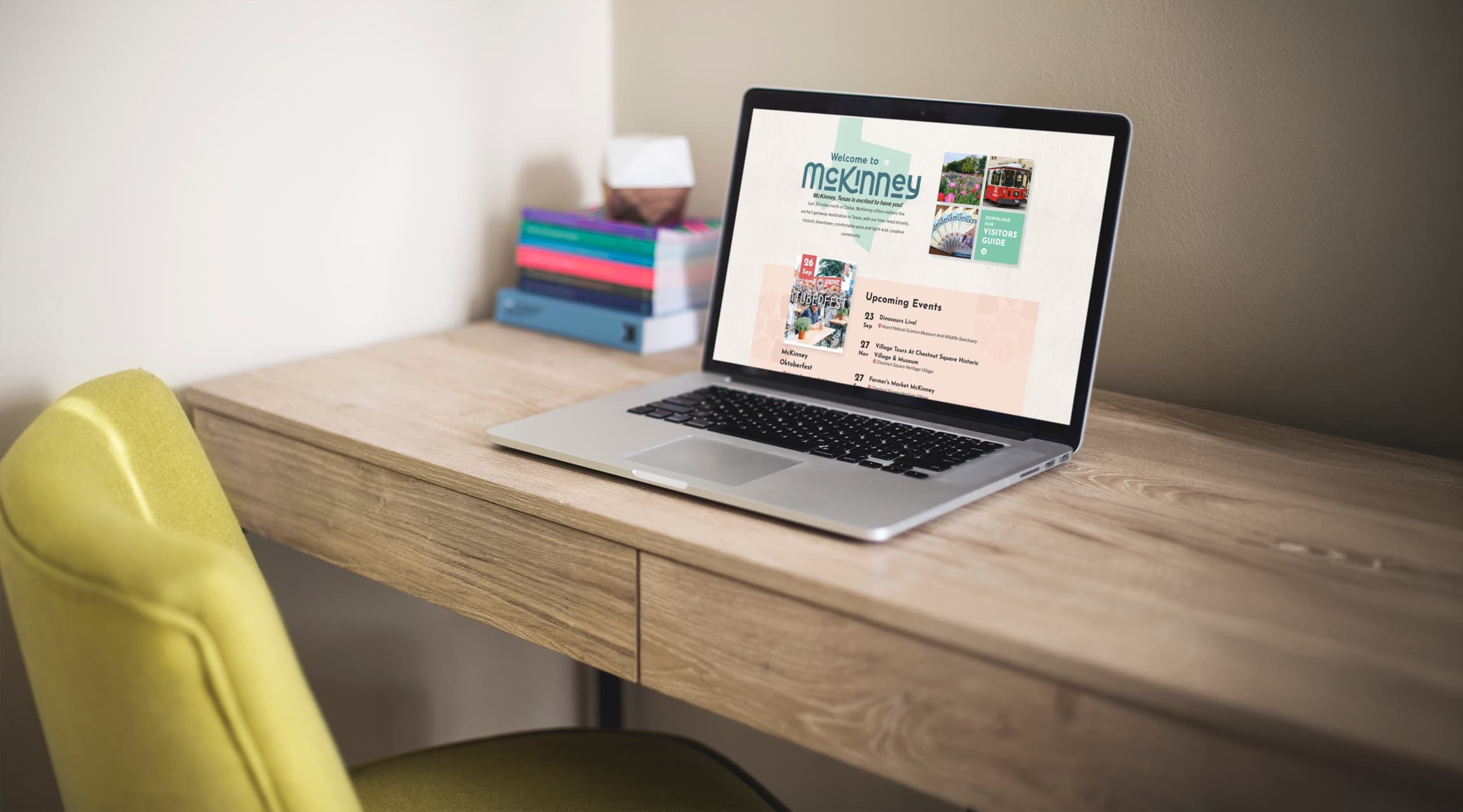 Visit McKinney destination website displayed on a laptop on a wooden desk