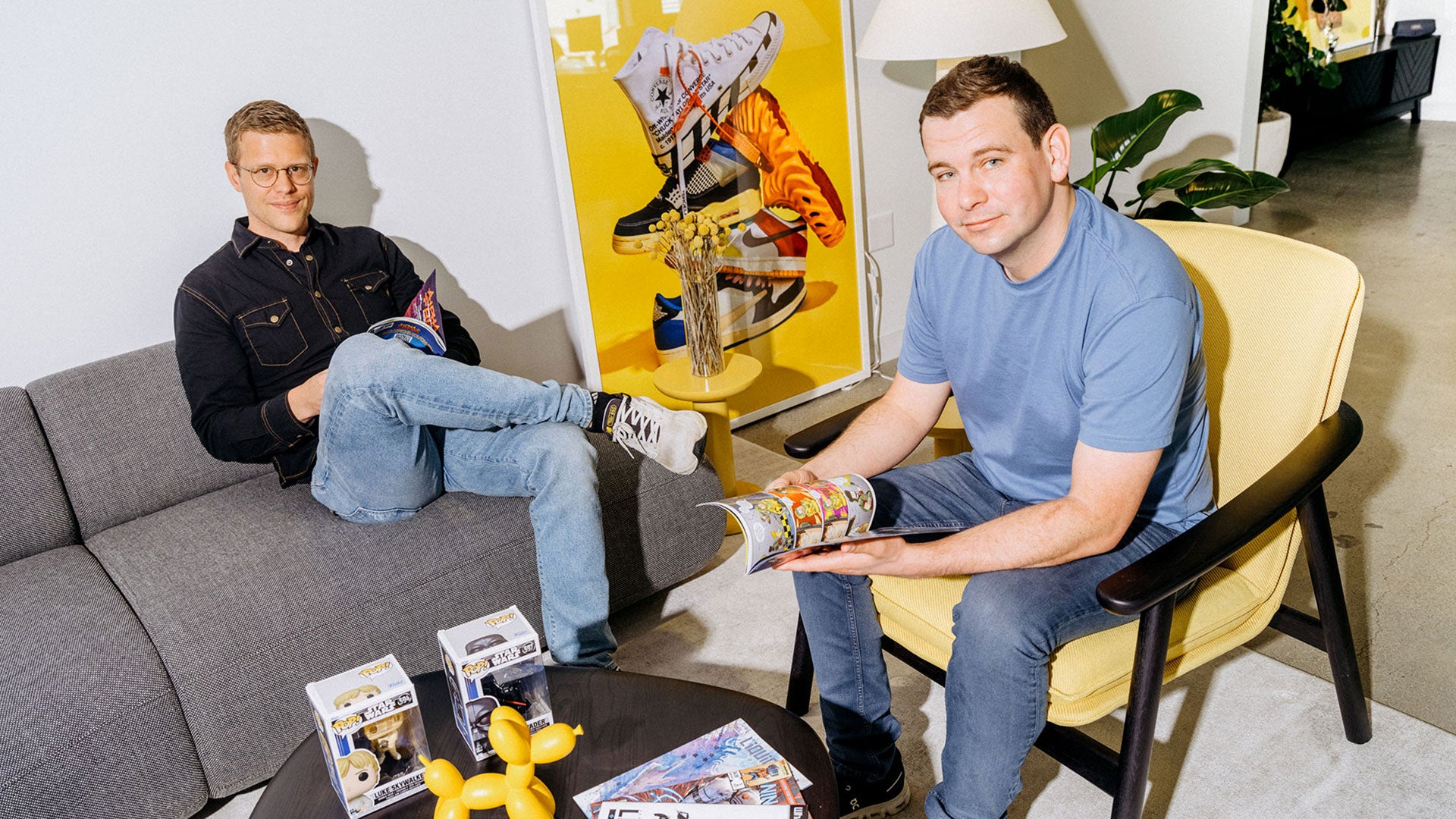 Grant LaFontaine and Logan Head seated in the Whatnot office among collectible figures and magazines