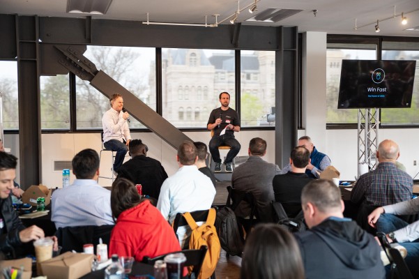 R-Zero colleagues taking part in a discussion at their team summit