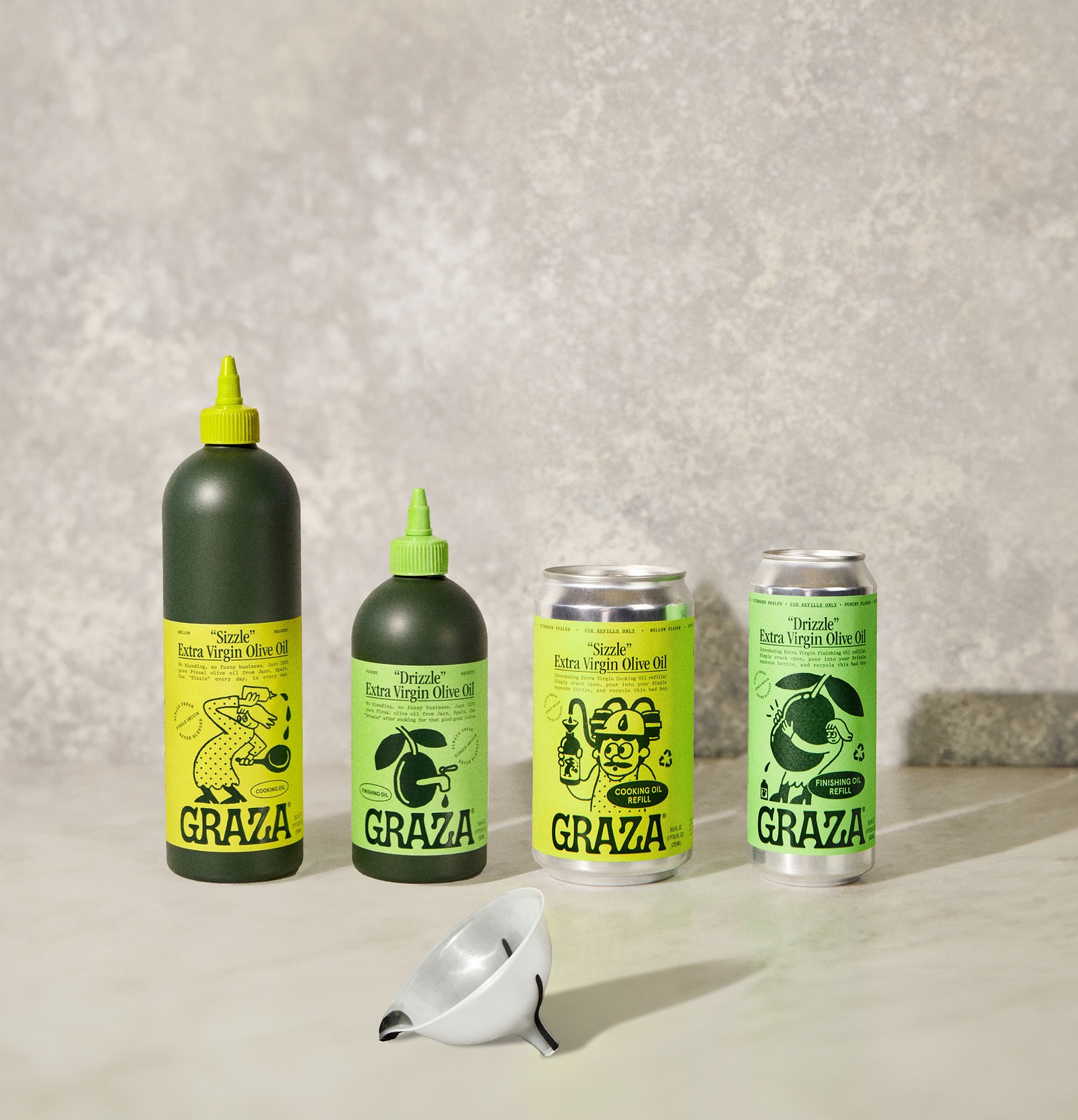 Graza Sizzle and Drizzle bottles with matching refill cans and a funnel