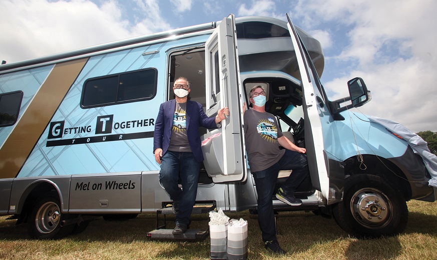 Richard Rosenbaum and Brian Duffy beside the Mel on Wheels RV in 2021