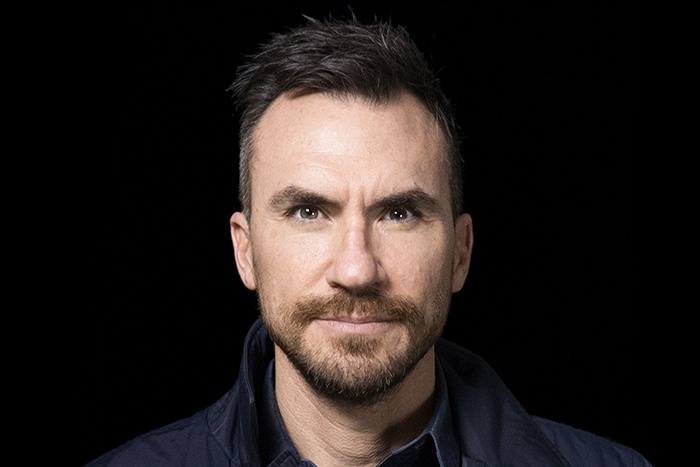 Greg Andersen in a navy shirt, in the press photograph accompanying his 2017 interview