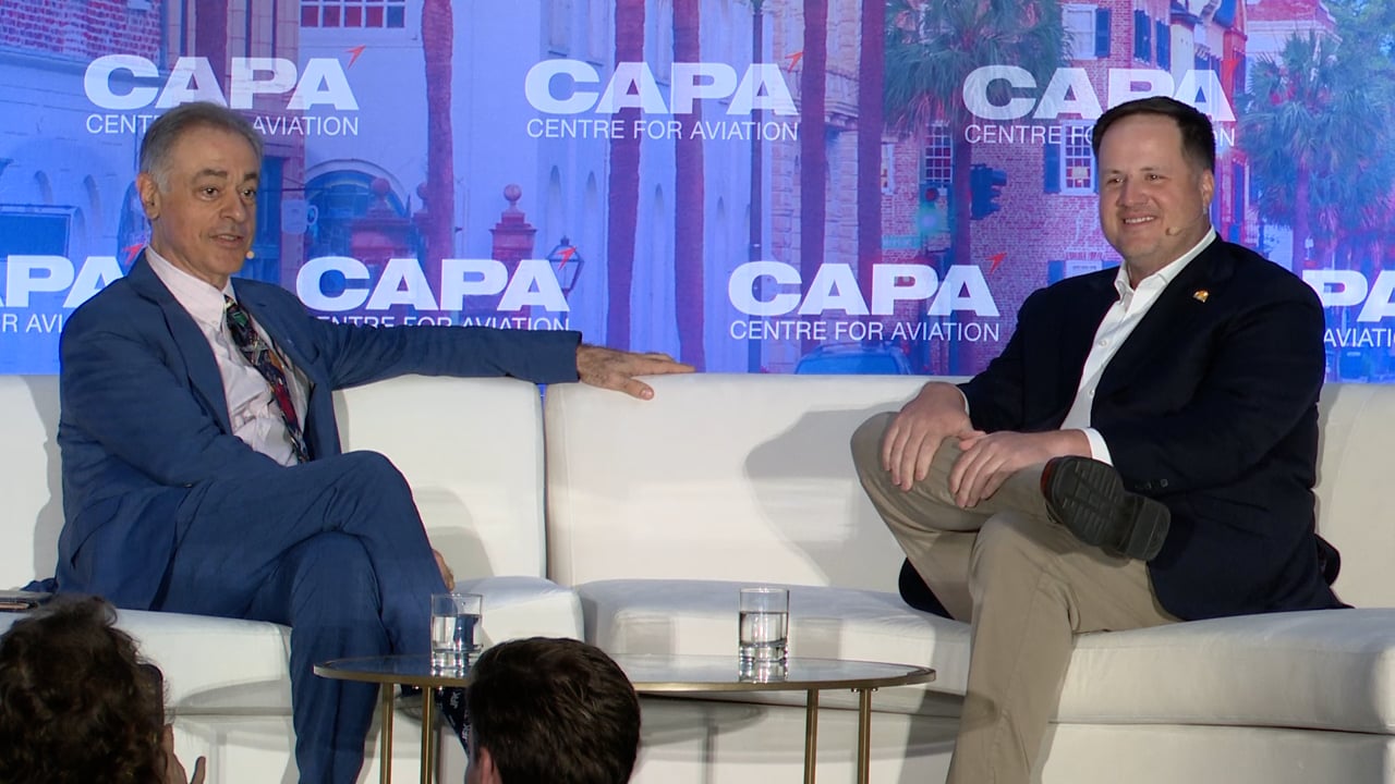 Greg Anderson, seated at right, in conversation with Michael Bell at the CAPA Airline Leader Summit in Charleston