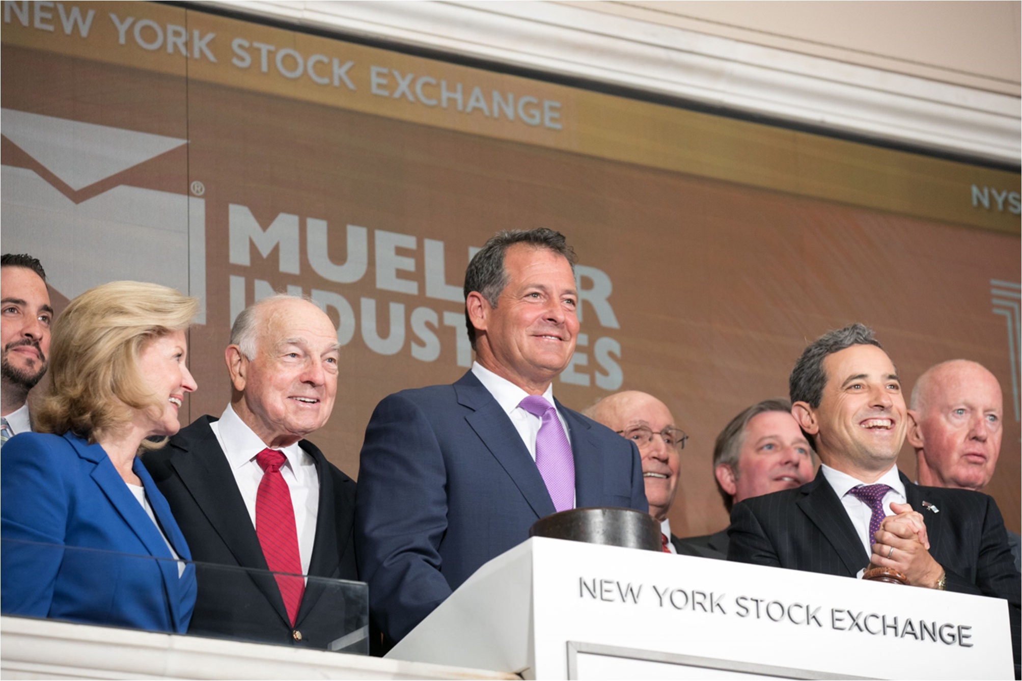 Greg Christopher and Mueller colleagues at the New York Stock Exchange closing bell ceremony