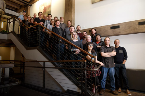 The Presence Labs team gathered on a staircase in its Seattle studio